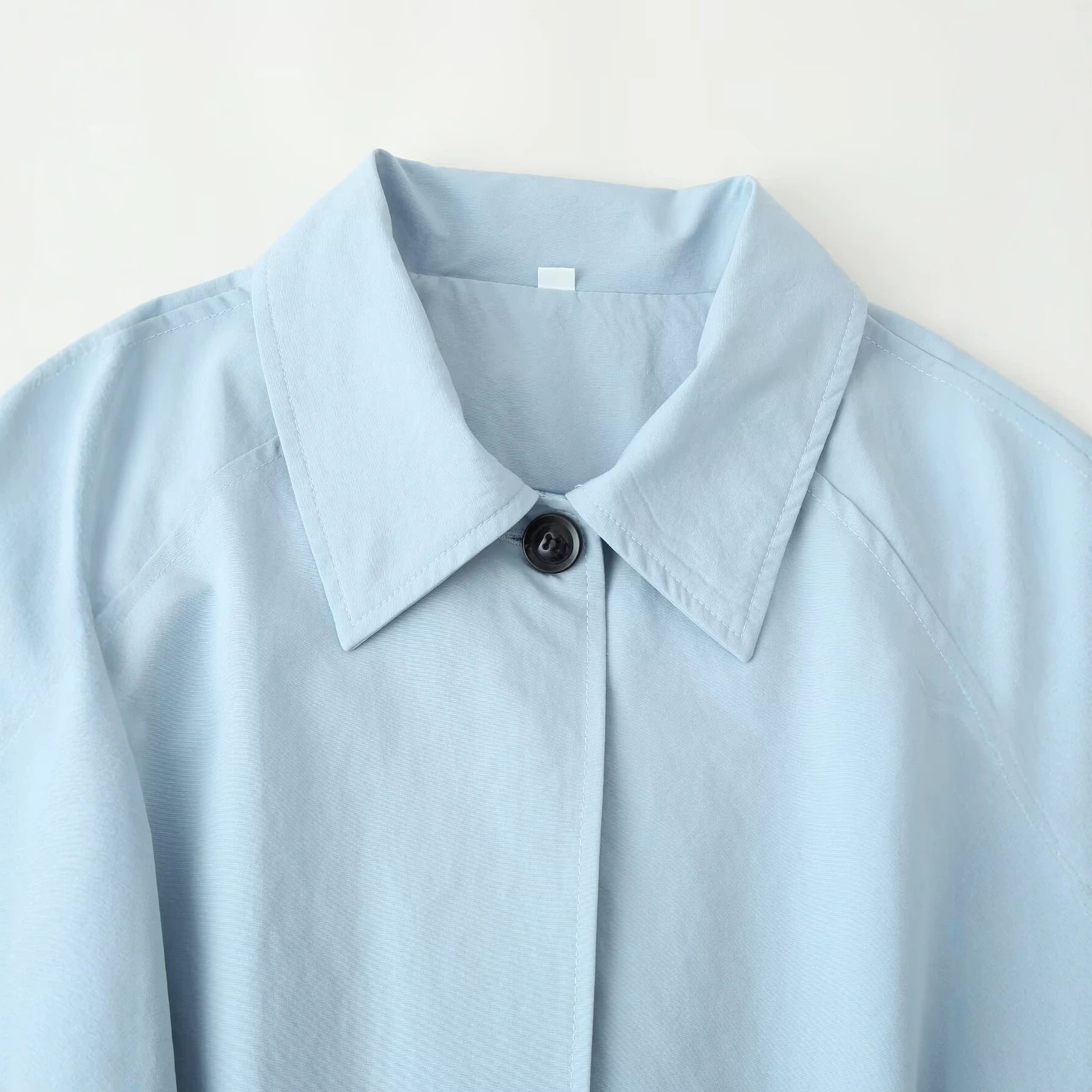 Image of Women's light blue long belted trench coat