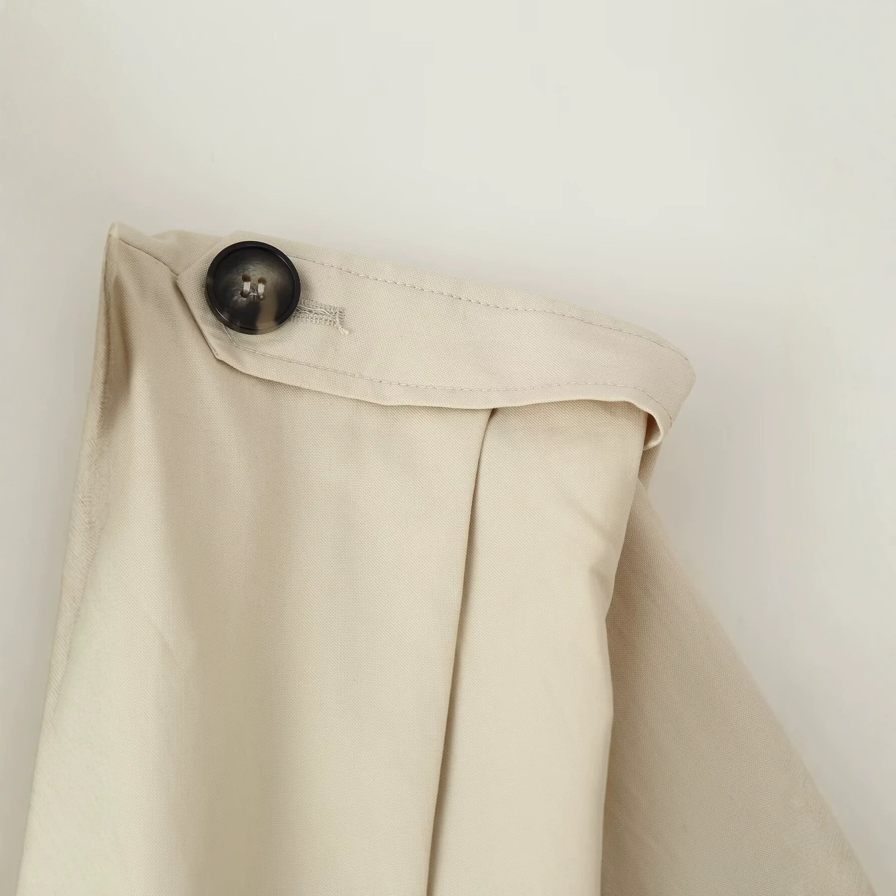 Image of Women's beige pleated stand collar trench coat