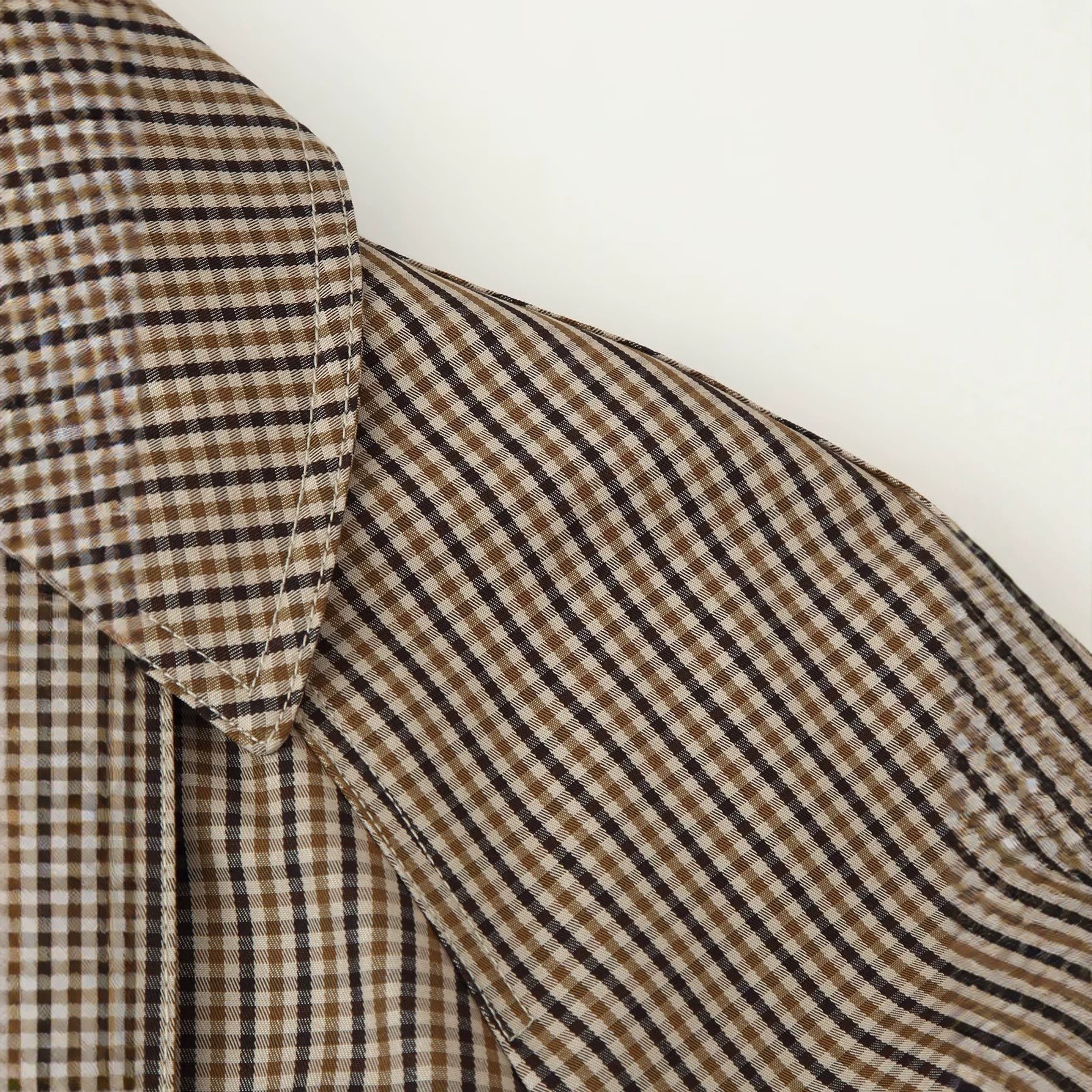 Image of Women's belted brown plaid double-breasted trench coat