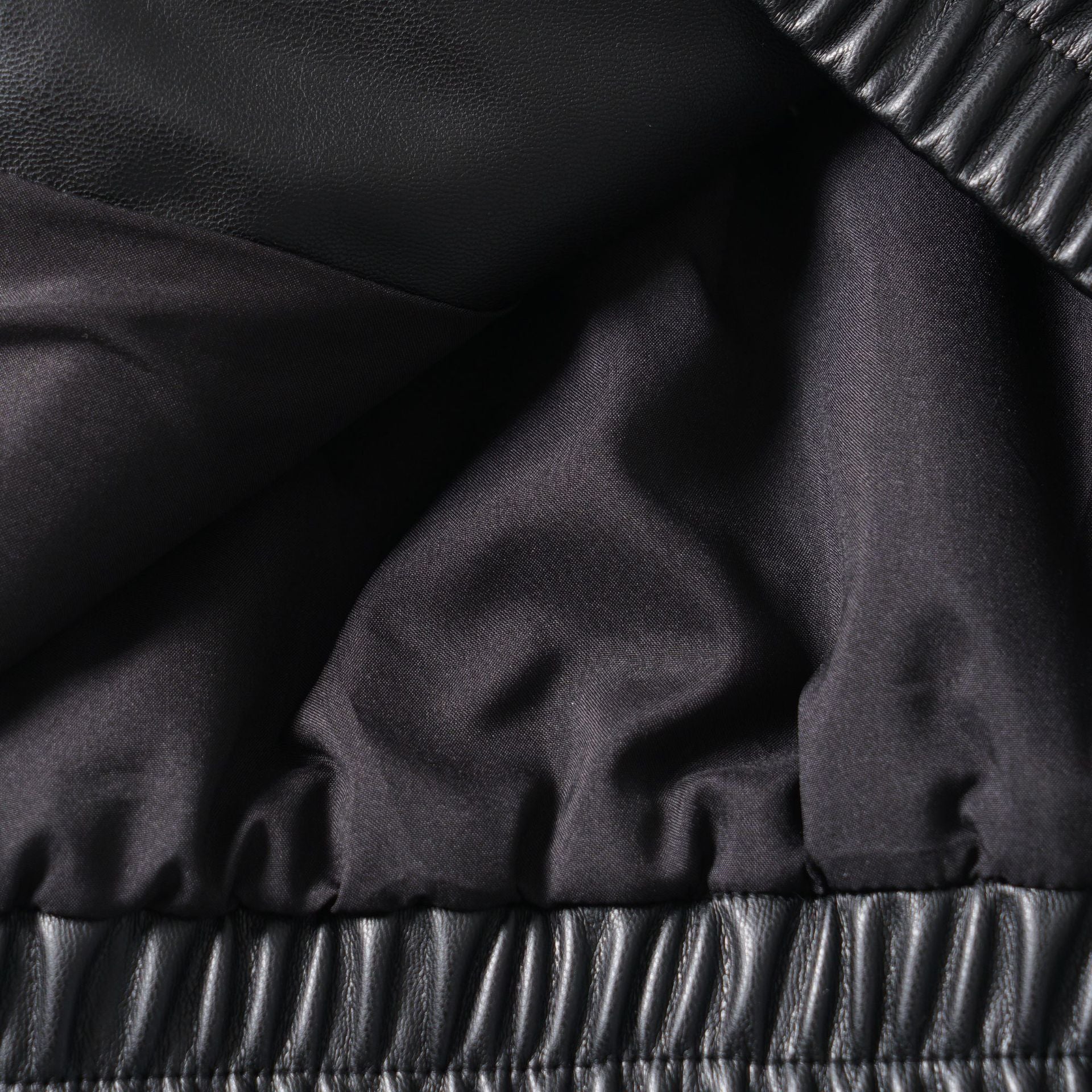 Image of Women's black zip-up faux leather jacket