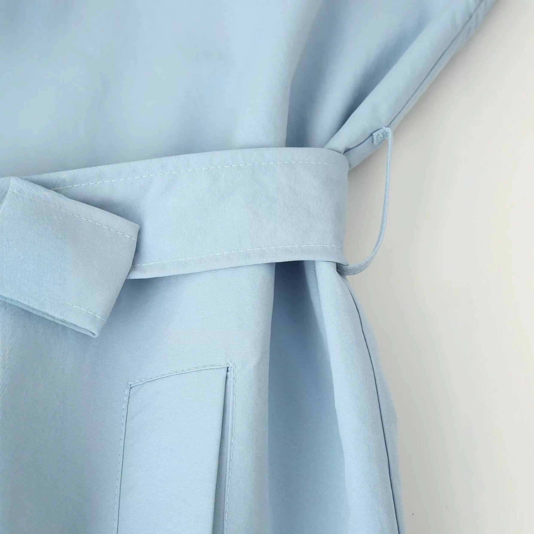 Image of Women's light blue long belted trench coat