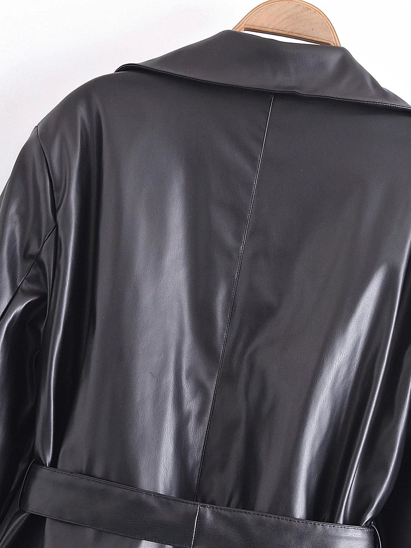Image of Black belted faux leather trench coat