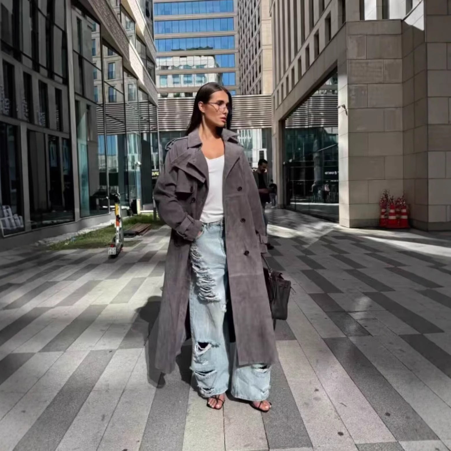 Image of Women's loose fit double-breasted belted trench coat