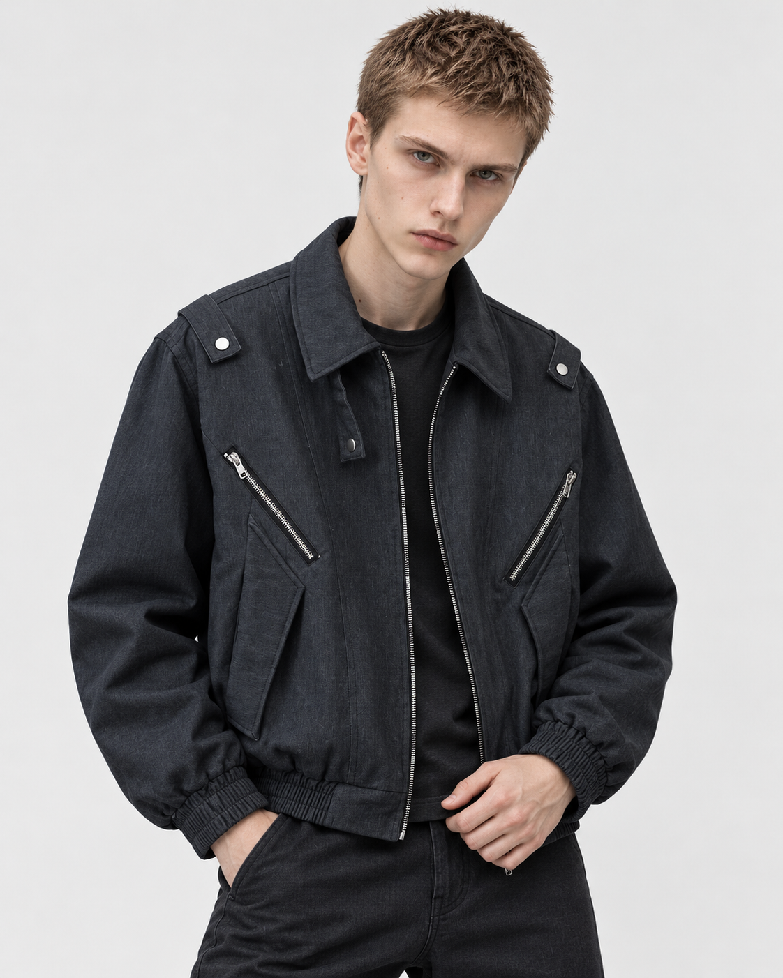 Black | Male model wearing the black zip-up jacket, studio pose