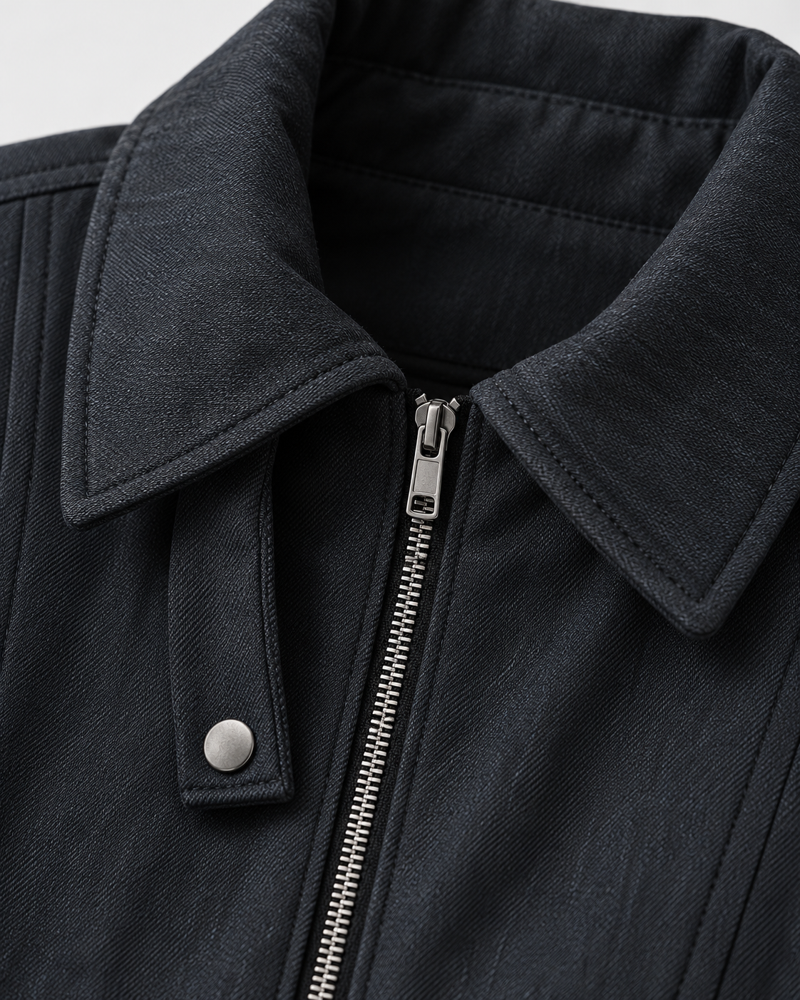 Black | Close-up of the collar zip detail on the black zip-up jacket