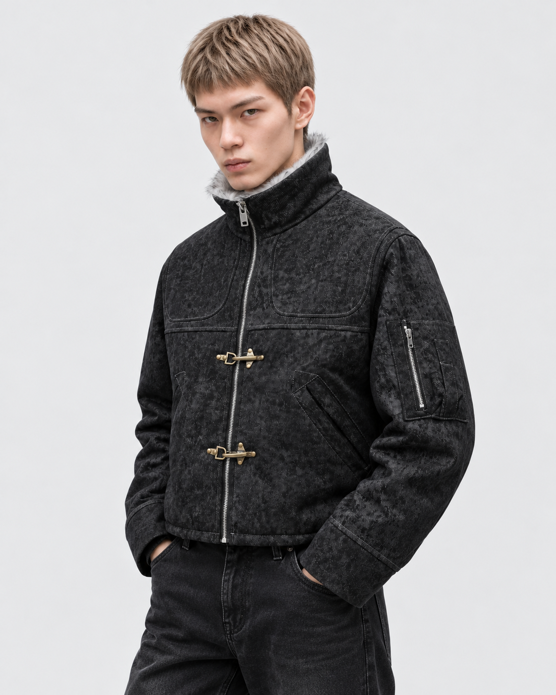 Image of Black | Male model wearing the black zip-up jacket, studio pose