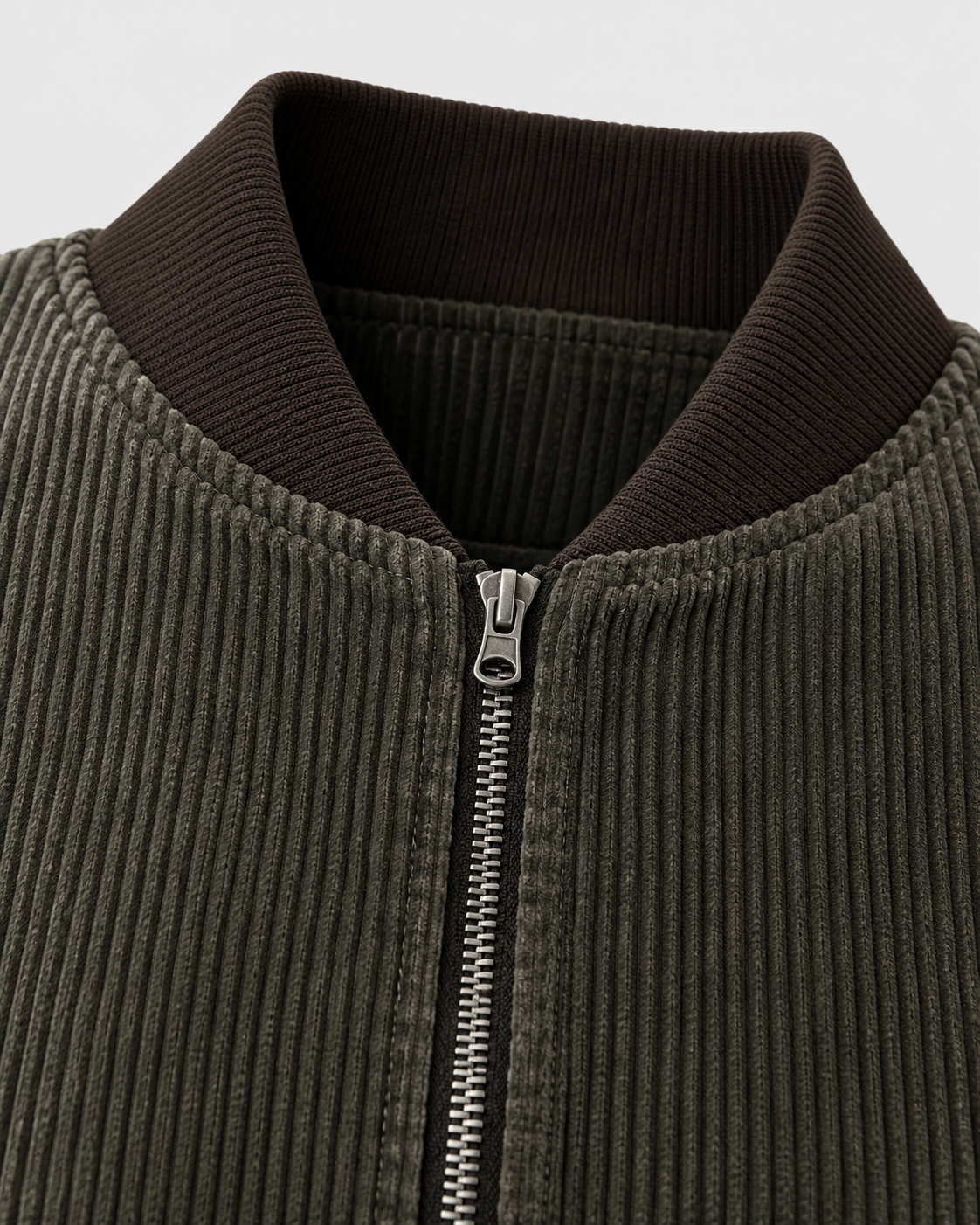 Image of Dark Brown | Close-up of the collar zip detail on the dark brown zip-up jacket