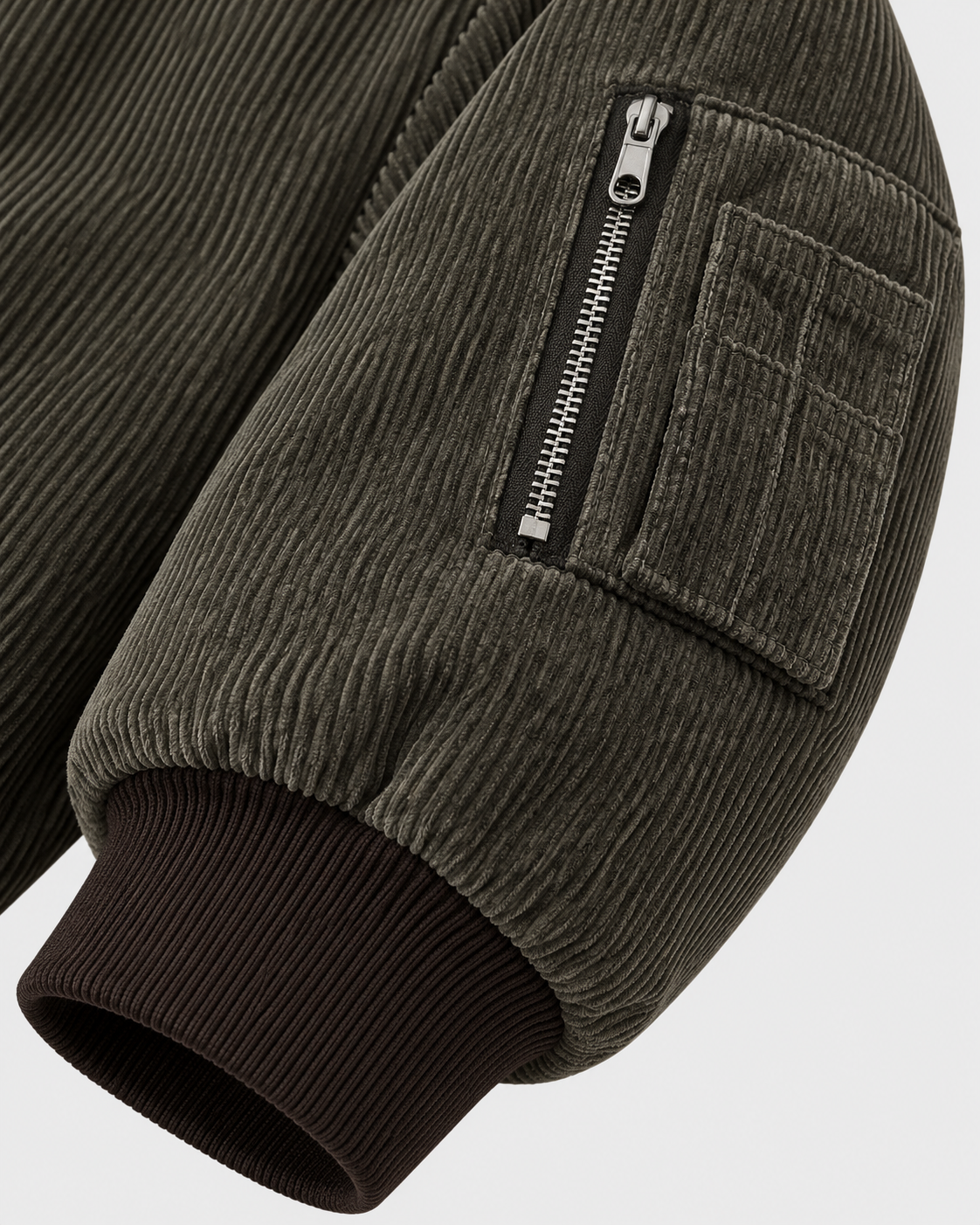 Image of Dark Brown | Close-up of the sleeve zip detail on the dark brown zip-up jacket