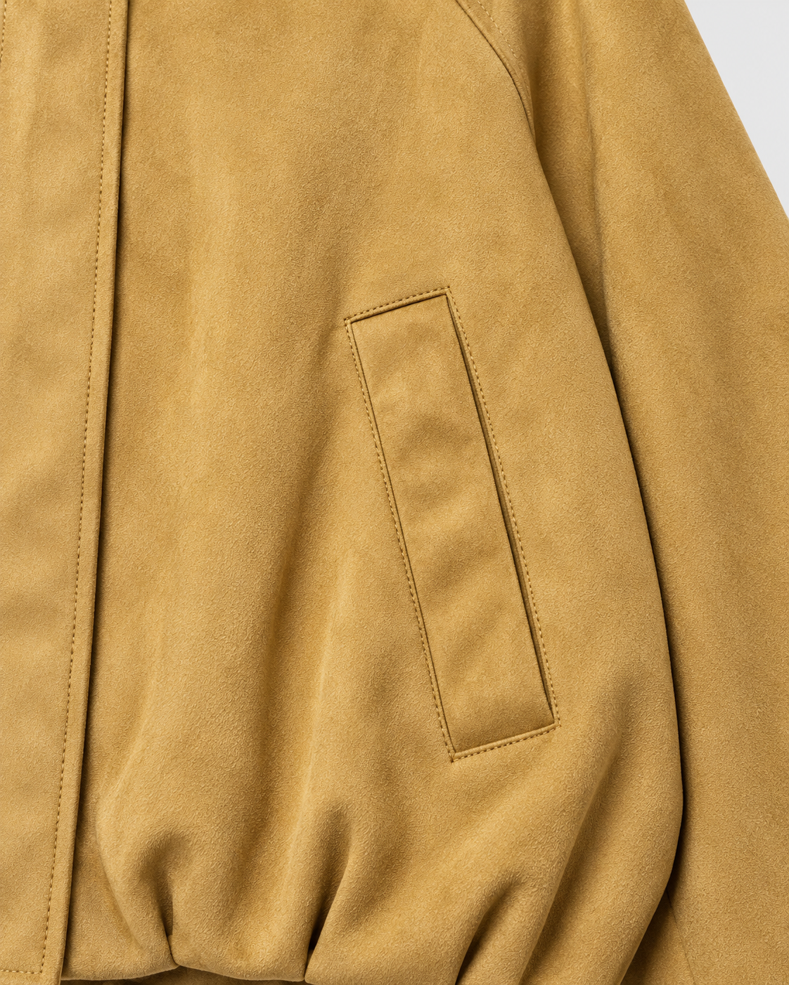 Khaki | Close-up of welt pocket and sleeve on khaki bomber jacket