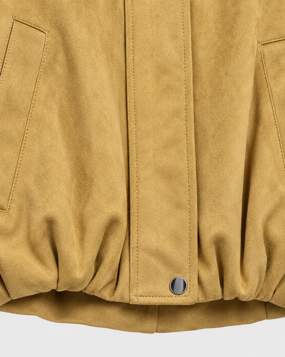 Khaki | Close-up of gathered hem and cuffs on khaki zip-up bomber jacket