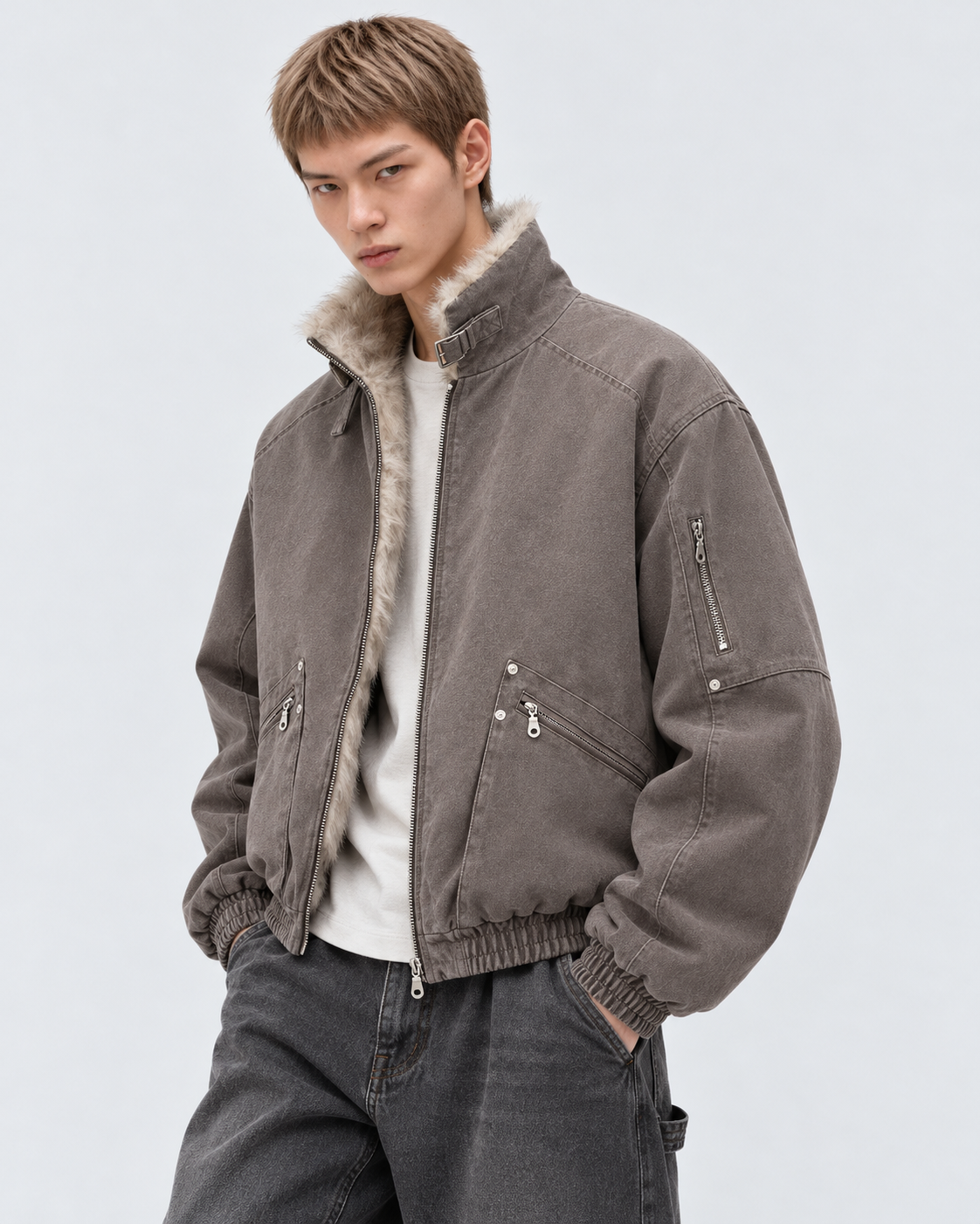 Image of Brown | Male model wearing the brown zip-up jacket, studio pose