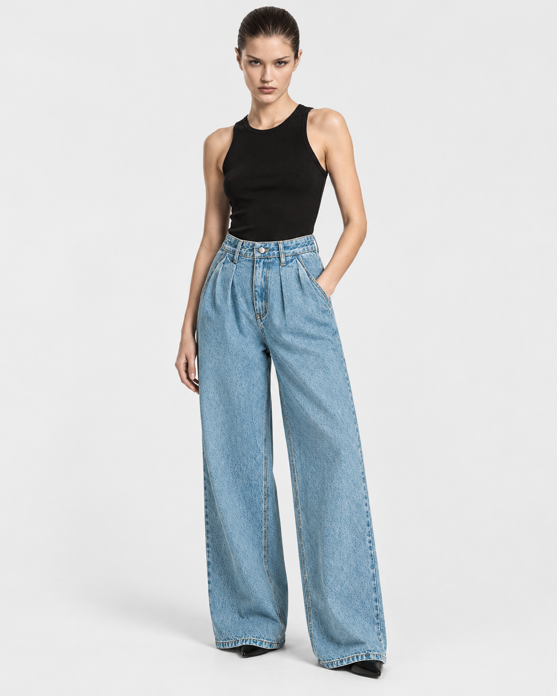 Medium | Model wearing medium-blue wide-leg jeans, front standing pose