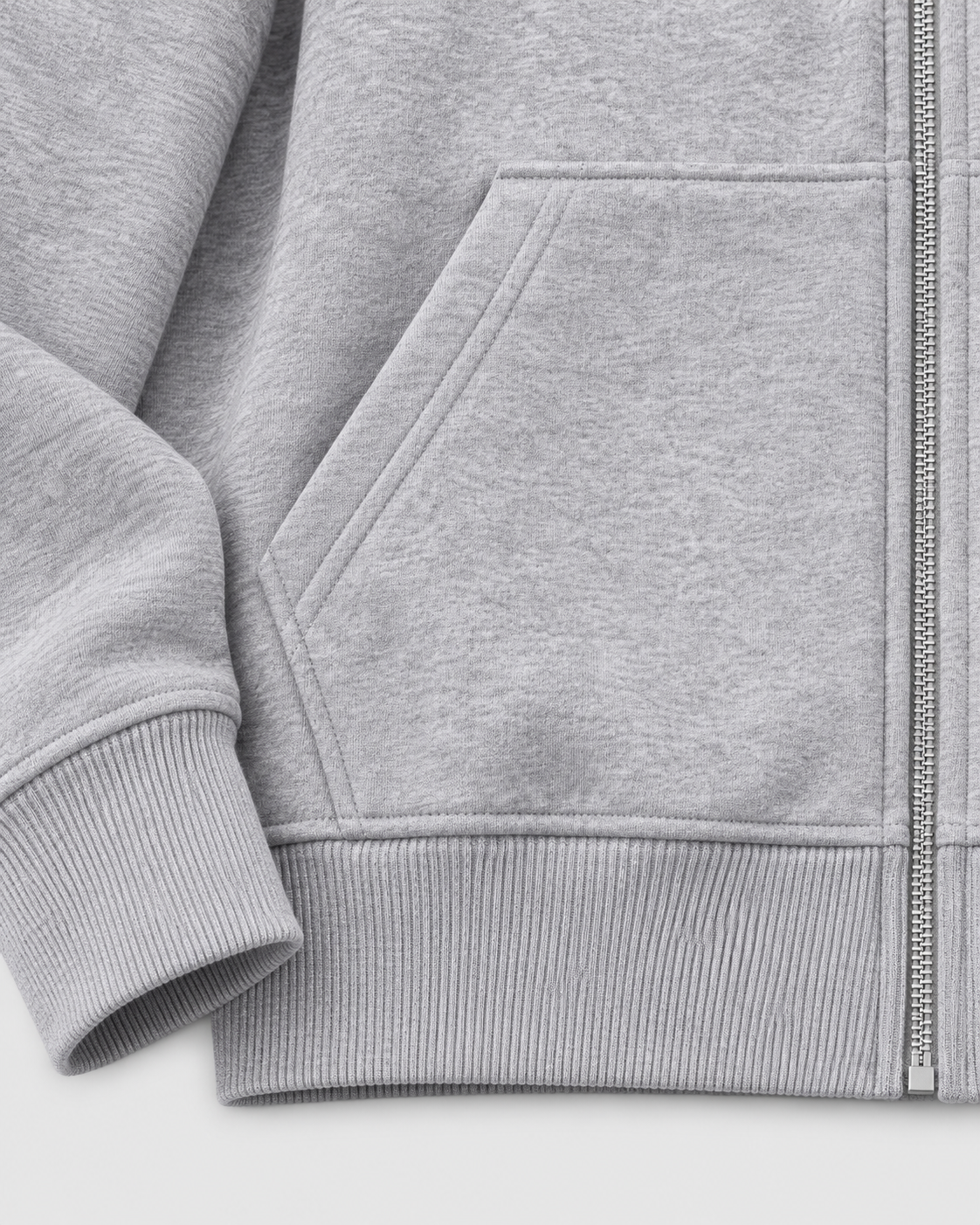 Heather Gray | Close-up of the heather gray hoodie's front pocket, ribbed cuff and waistband