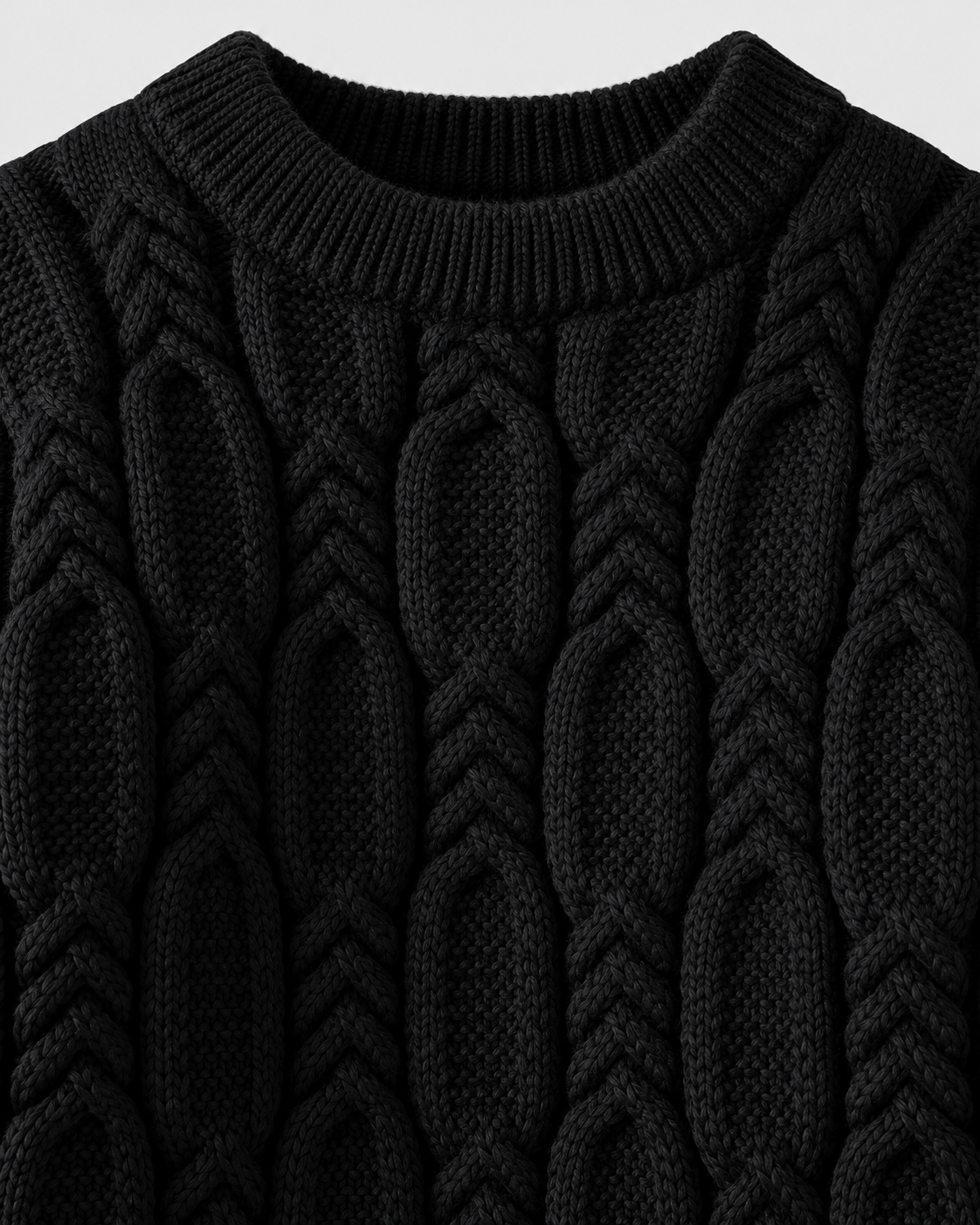 Image of Black | Macro of ribbed black crew neckline and thick cable-knit stitches