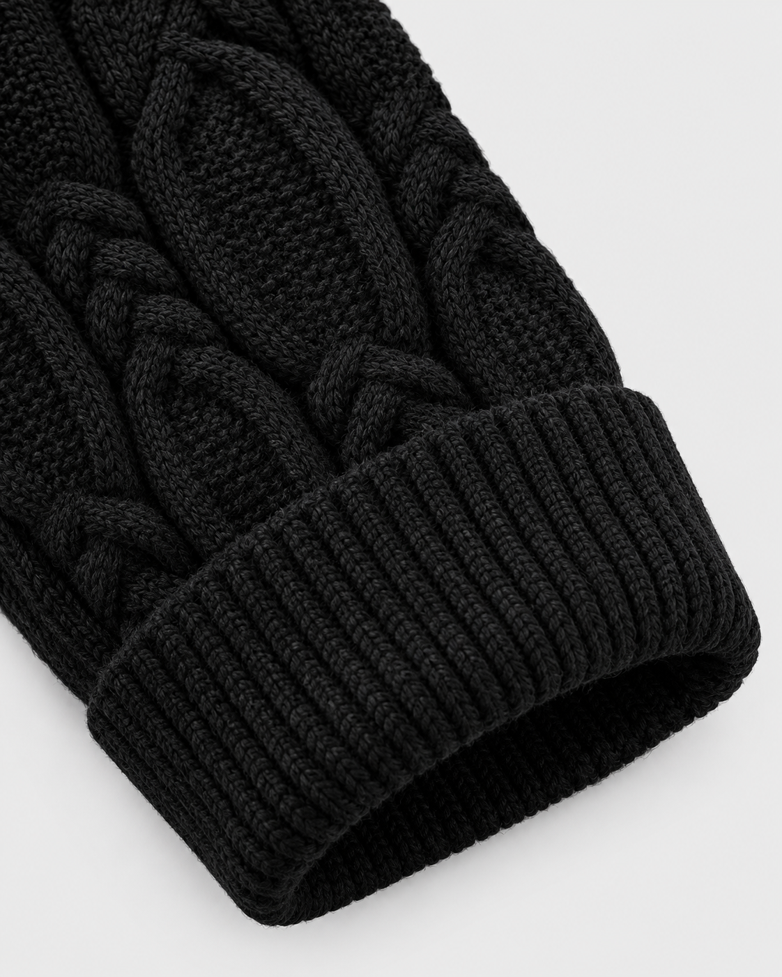Image of Black | Close-up of black knit sleeve and ribbed cuff construction