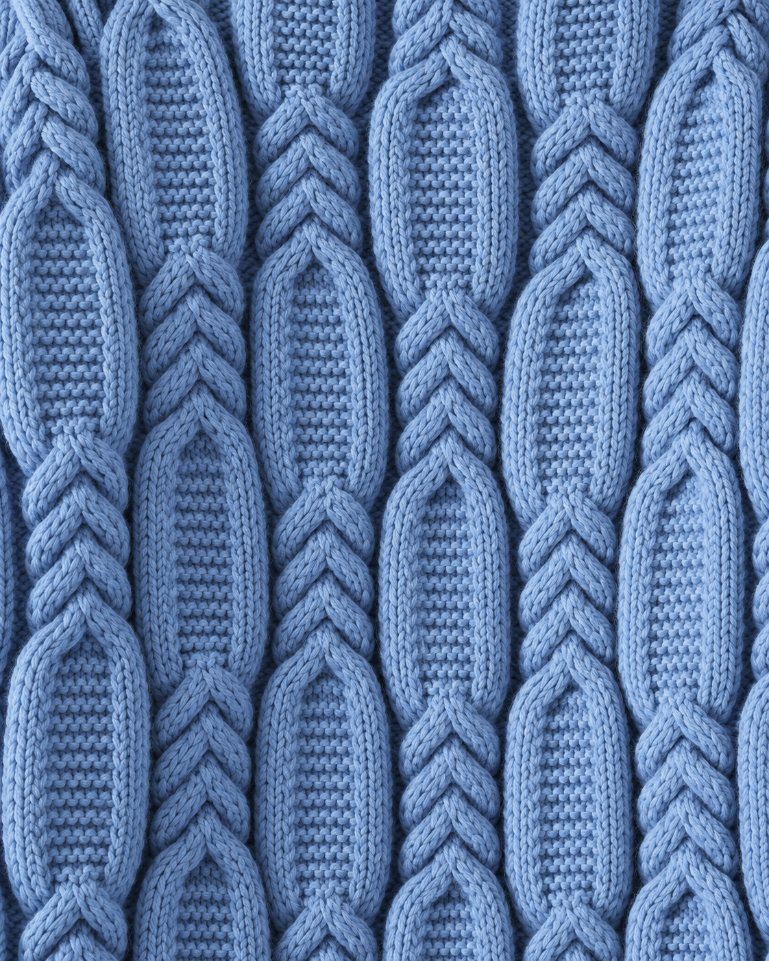Image of Blue | Macro of blue chunky cable-knit pattern across sweater front