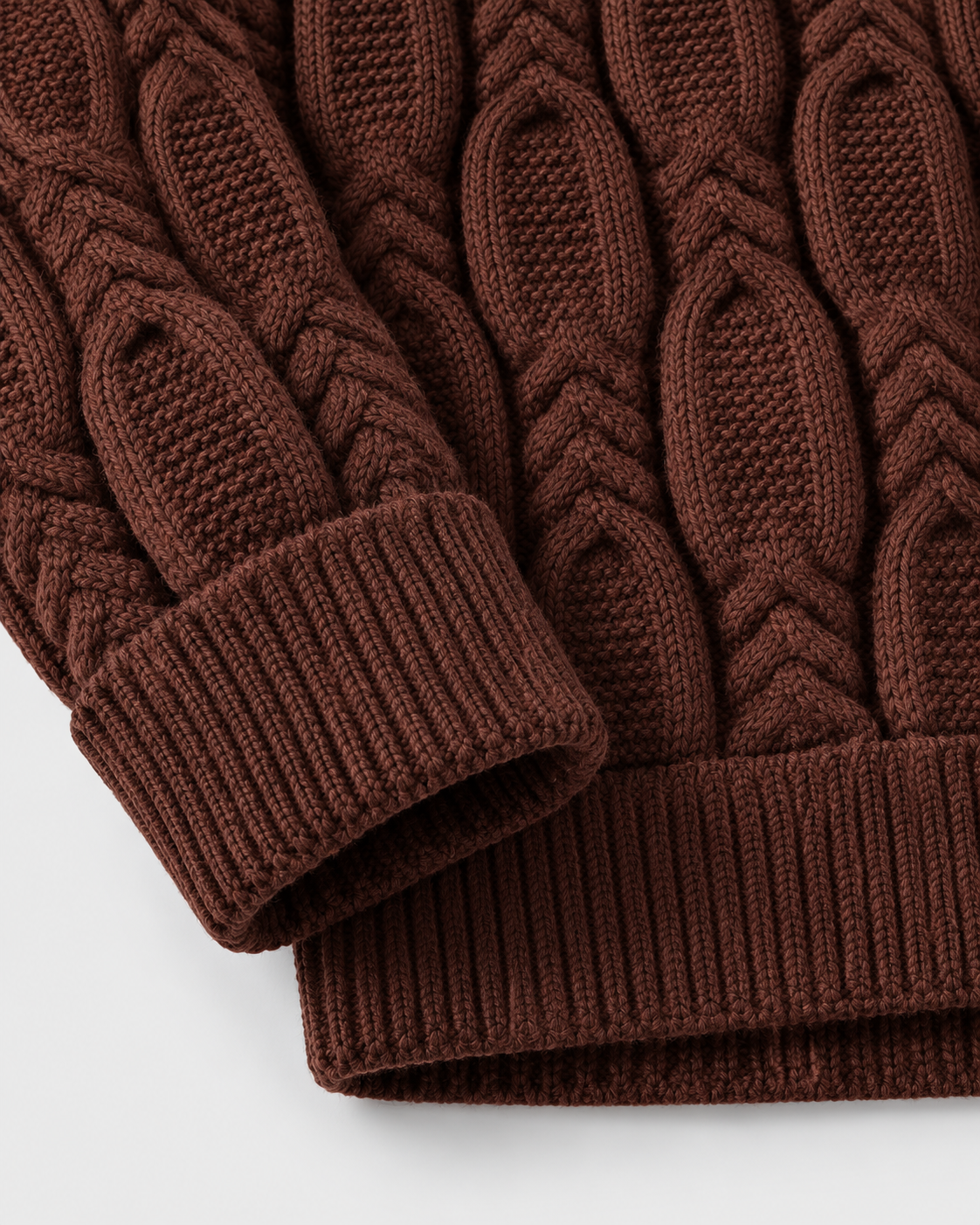 Image of Coffee | Close-up of coffee-brown sweater sleeve cuff and ribbed hem