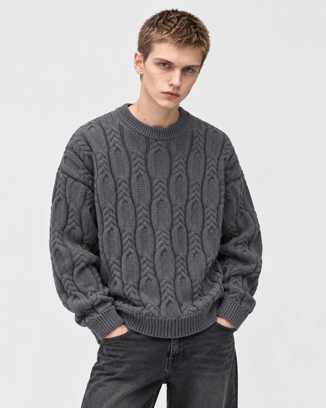 Image of Gray | Male model wearing gray cable-knit sweater, standing front studio pose