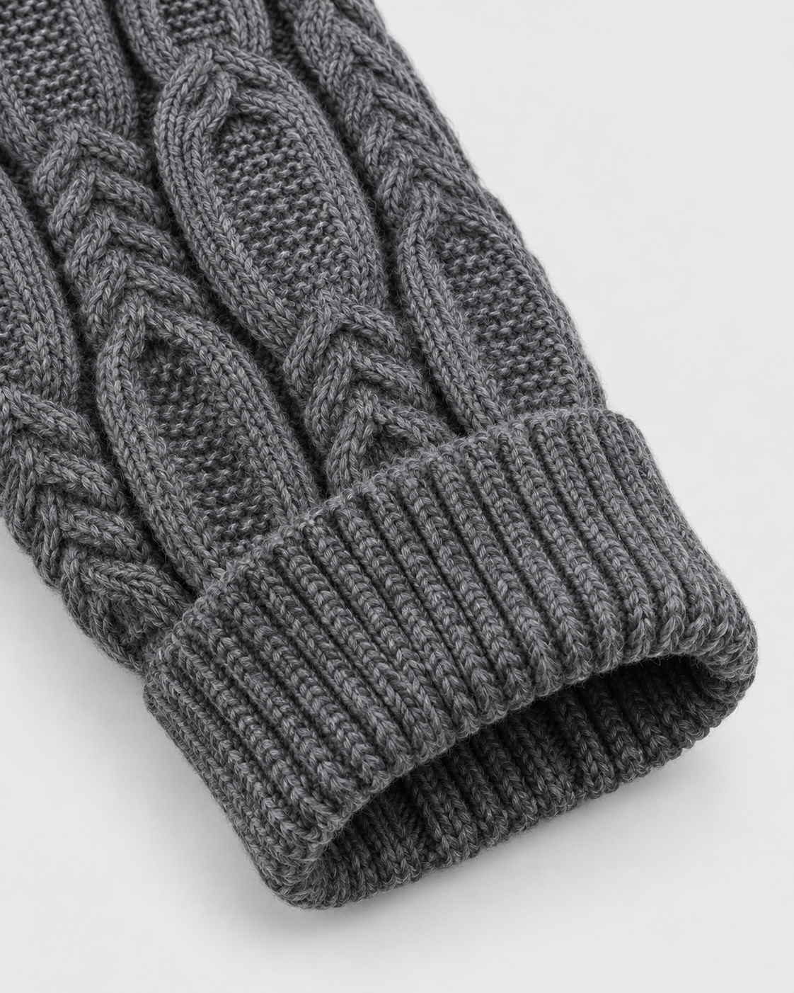 Image of Gray | Close-up of gray sweater ribbed sleeve cuff and cable-knit sleeve