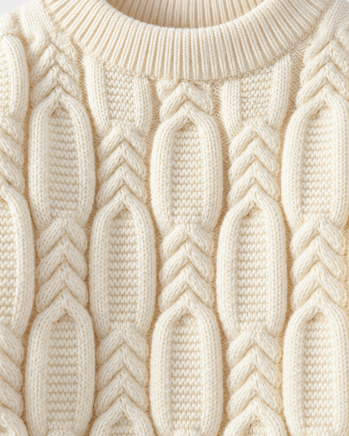 Image of Off-white | Macro of thick off-white cable-knit stitches on sweater front
