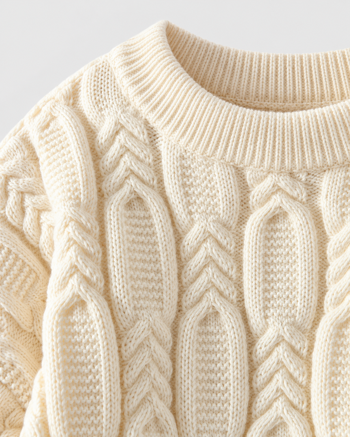 Image of Off-white | Close-up of ribbed off-white crew neckline and cable-knit pattern