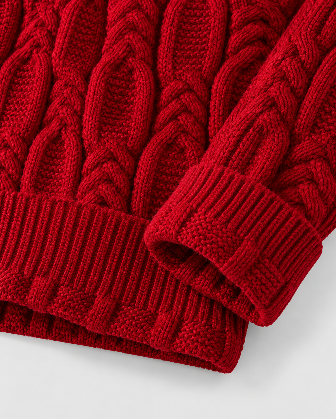 Image of Red | Detail of red sweater ribbed cuffs and cable-knit hem