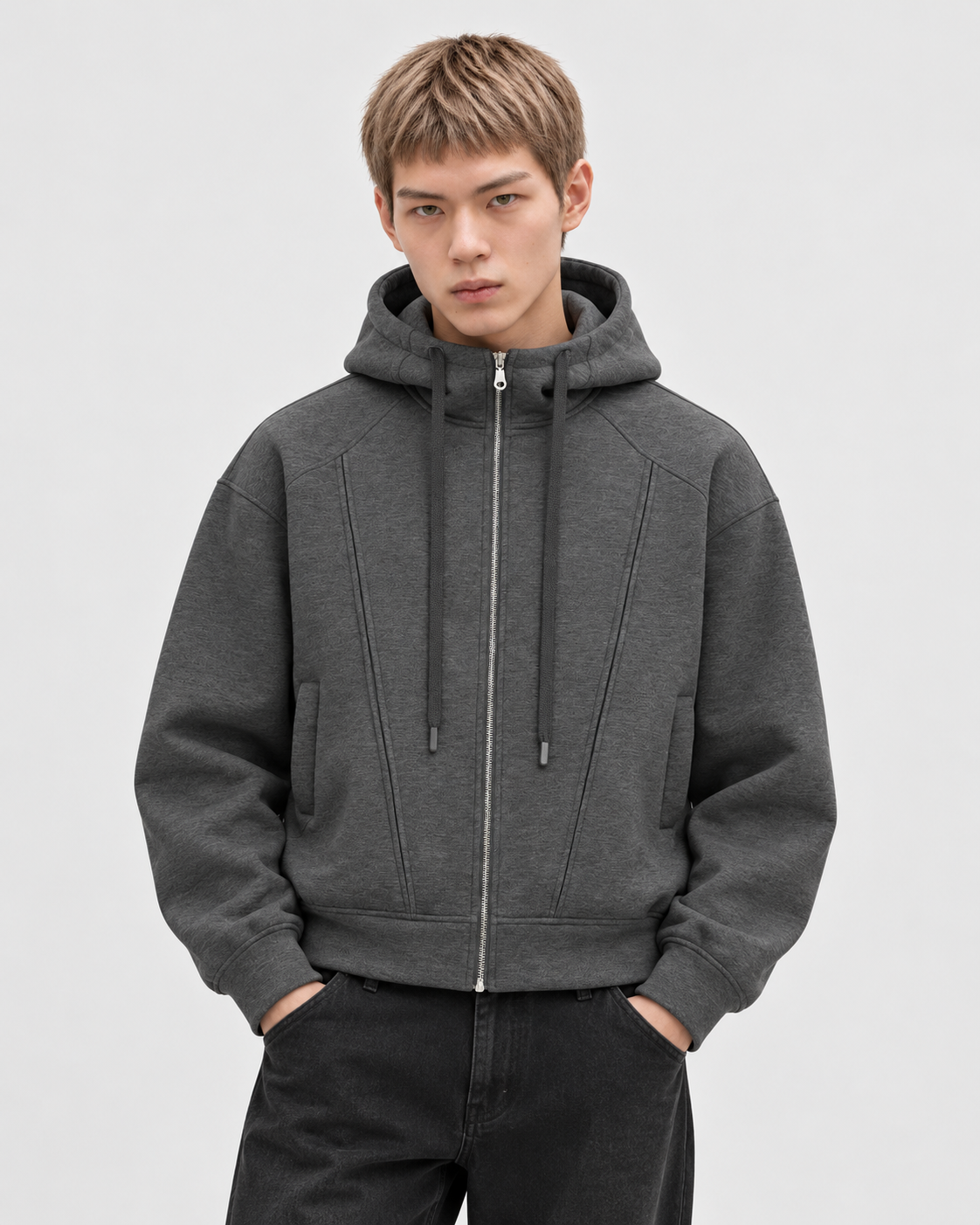 Gray | Male model wearing the zip-up hoodie in a standing studio pose