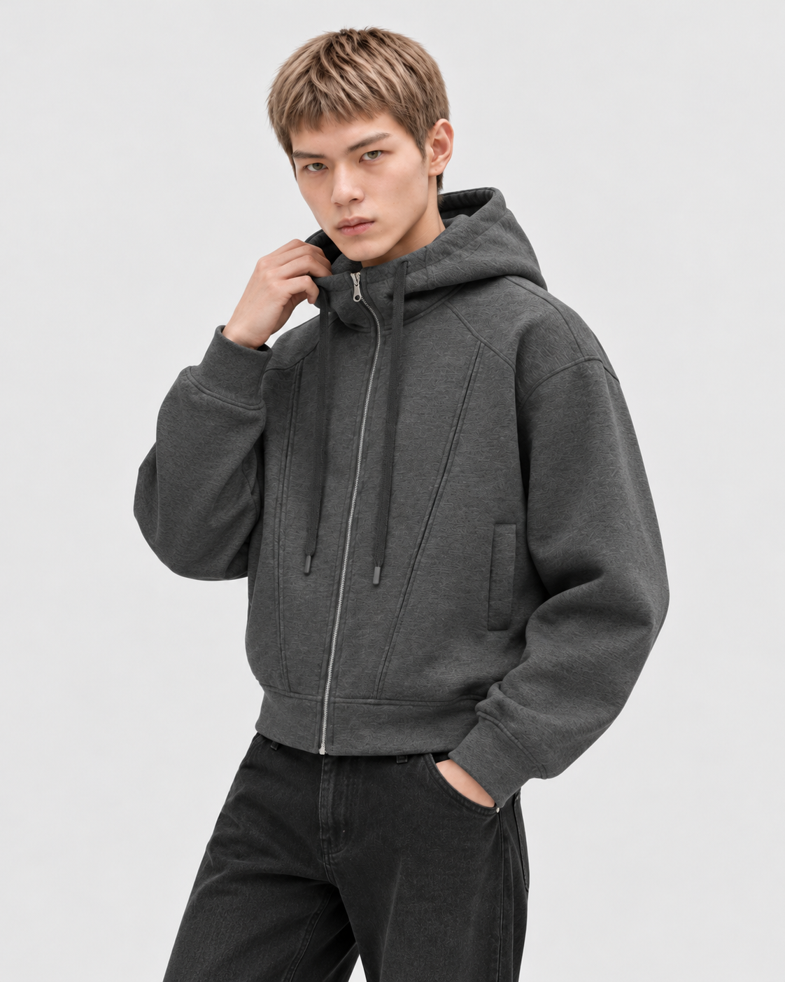 Gray | Male model wearing the oversized zip-up hoodie in an alternate studio pose