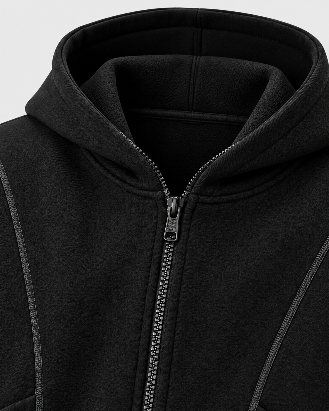 Image of Black | Close-up of the black zip-up sweatshirt hood and central zipper