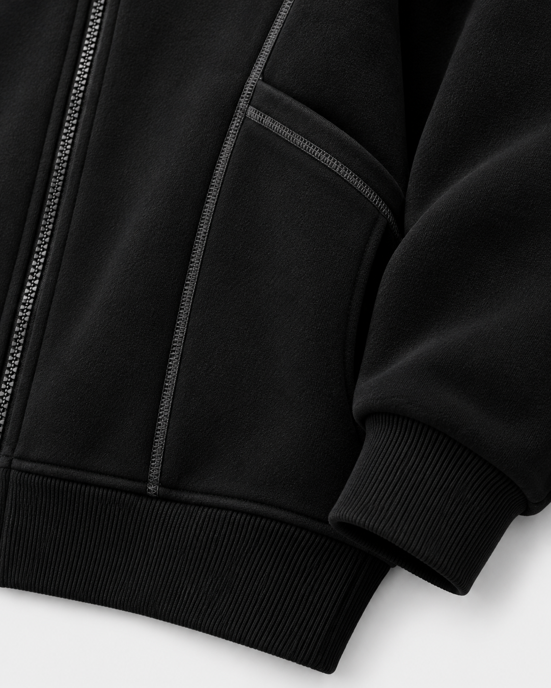 Image of Black | Close-up of the black zip-up sweatshirt sleeve cuff and hem