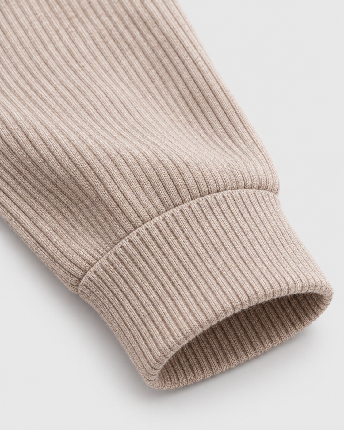 Image of Beige | Close-up of the sleeve cuff and ribbed hem
