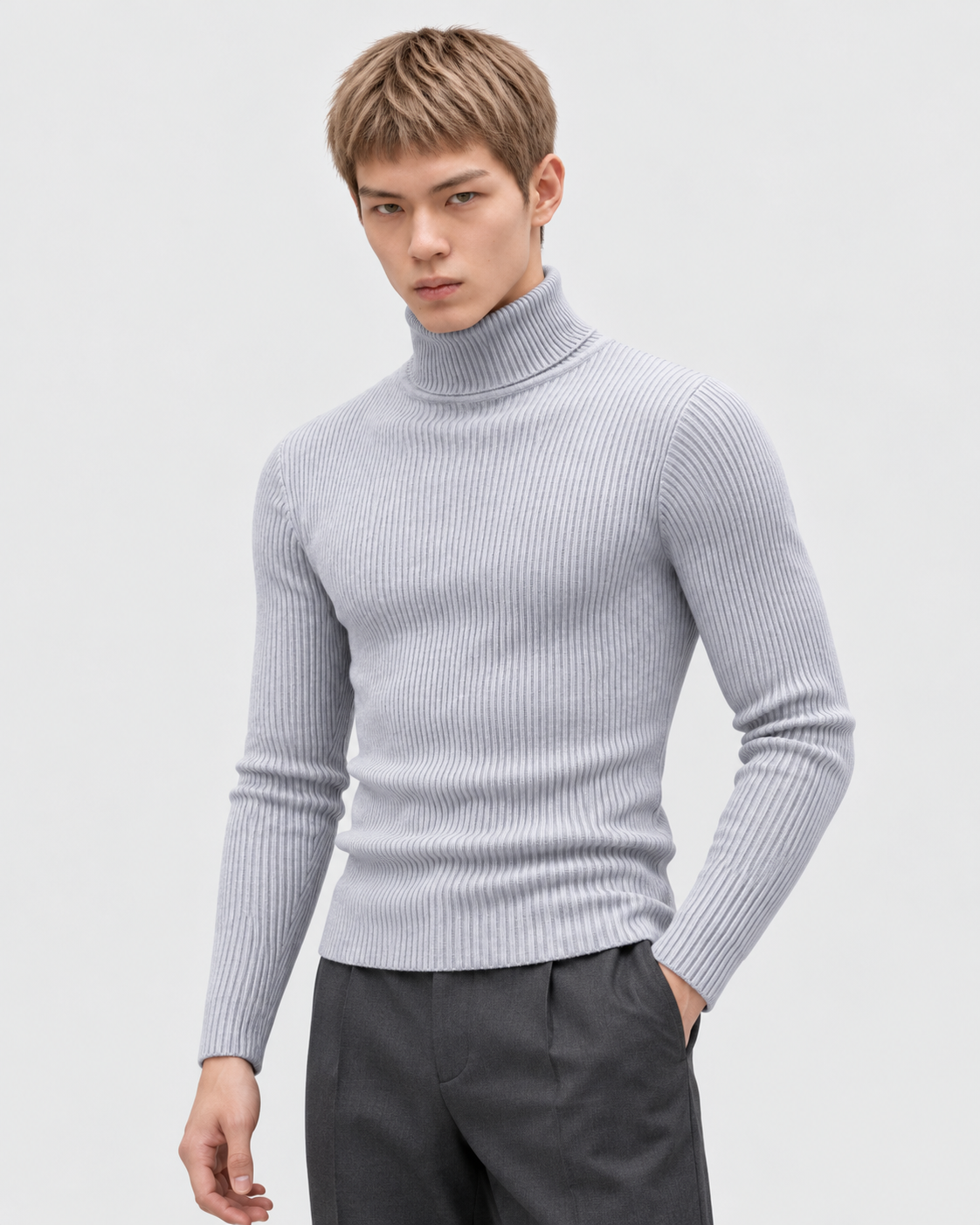 Image of Gray | Male model wearing the ribbed turtleneck sweater in a standing studio pose