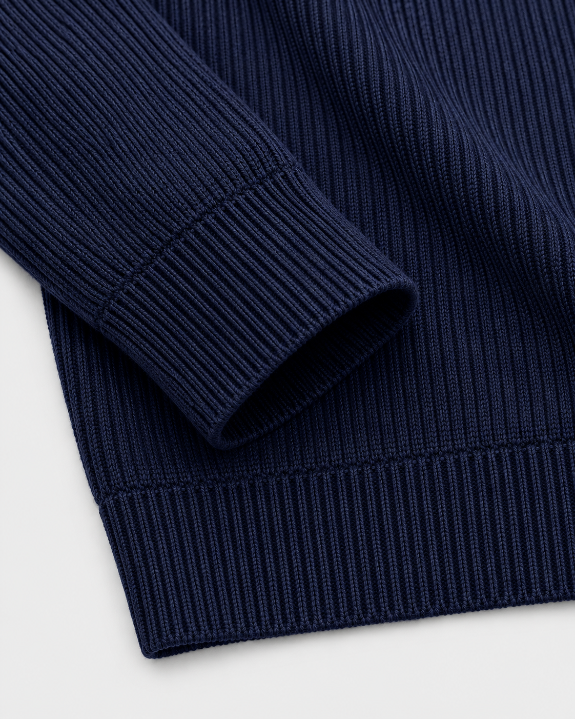 Navy | Close-up of the sleeve cuff and ribbed hem