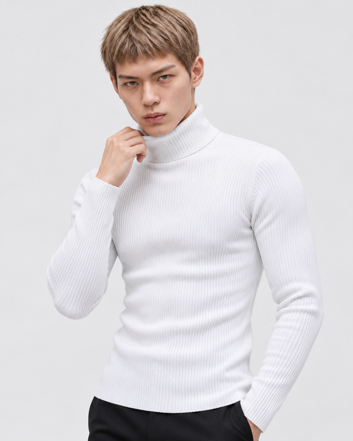White | Male model wearing the ribbed turtleneck sweater in a standing studio pose