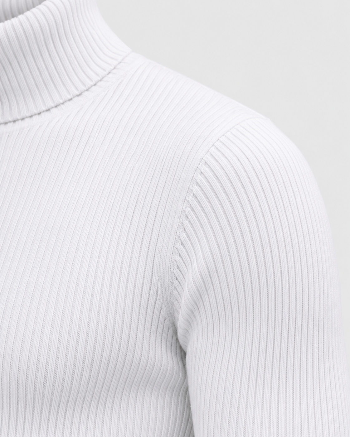 White | Close-up of the sweater's ribbed knit texture across the upper body
