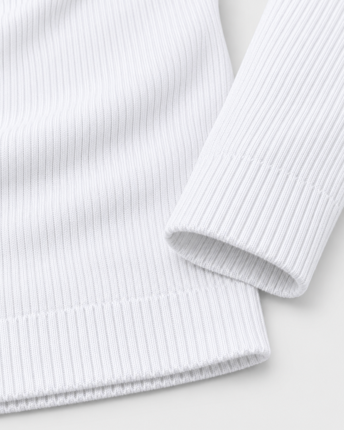 Image of White | Close-up of the sleeve cuff and ribbed hem
