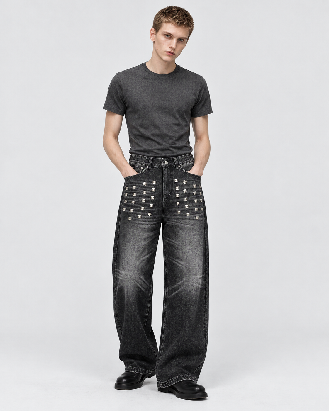 Black | Male model wearing black washed straight-leg jeans in a studio pose