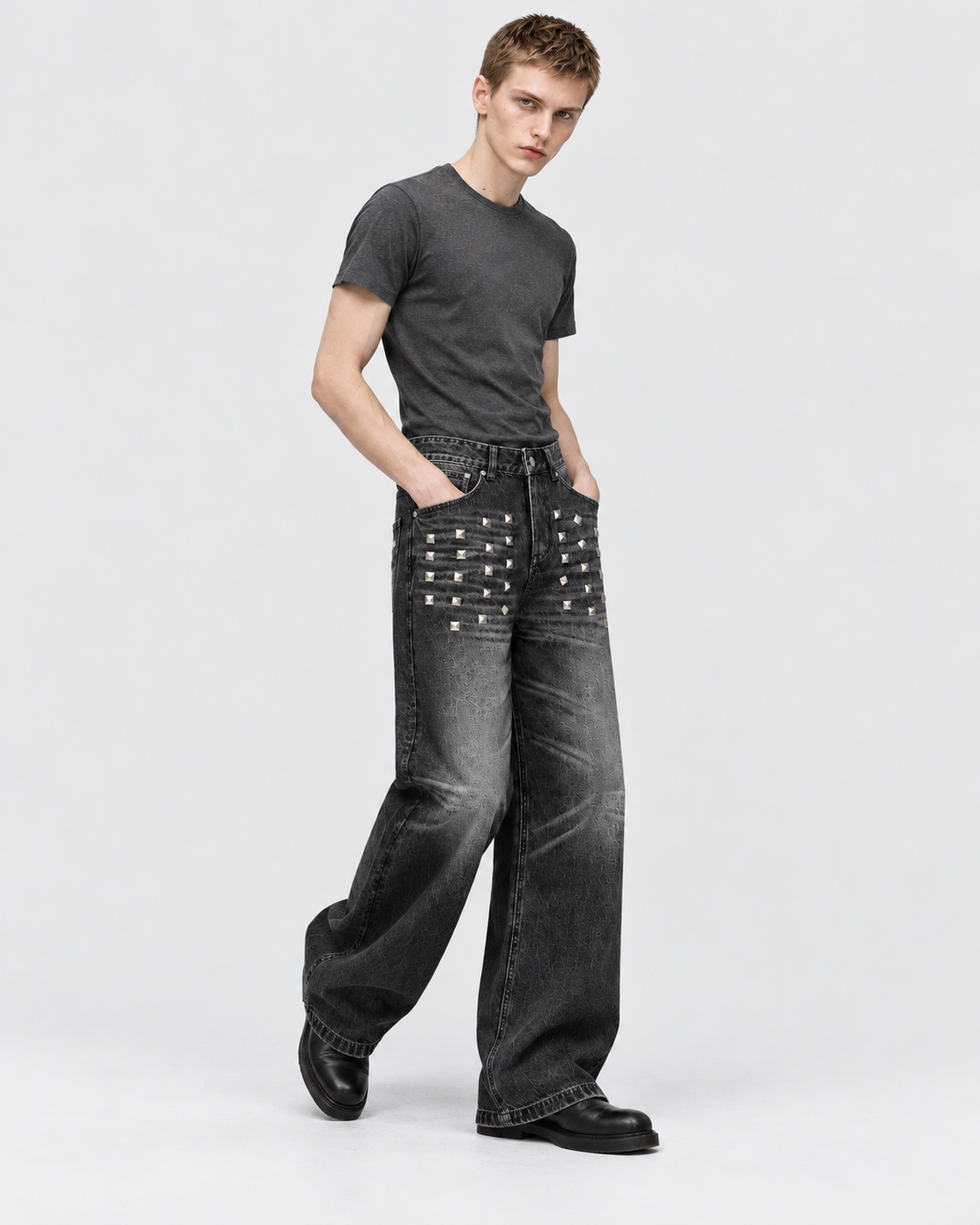 Black | Male model wearing black washed straight-leg jeans in a second studio pose