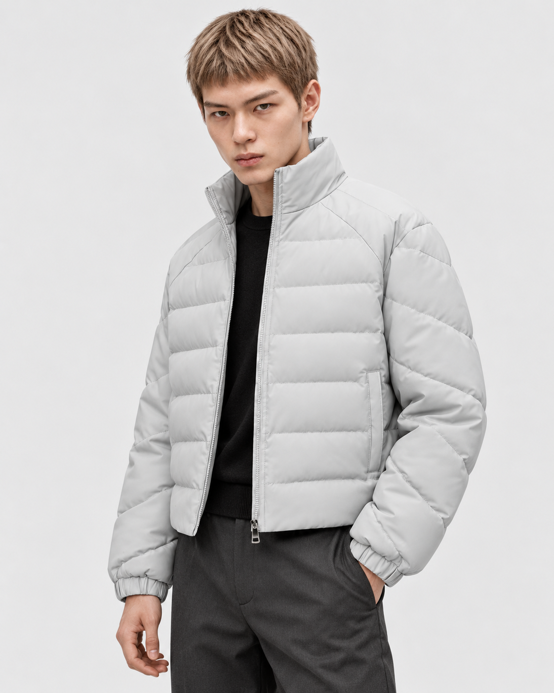 Gray | Male model wearing the oversized quilted stand-collar puffer jacket in a standing studio pose