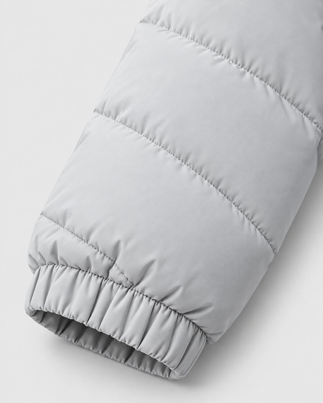 Image of Gray | Close-up of the quilted sleeve and elastic cuff of the padded jacket