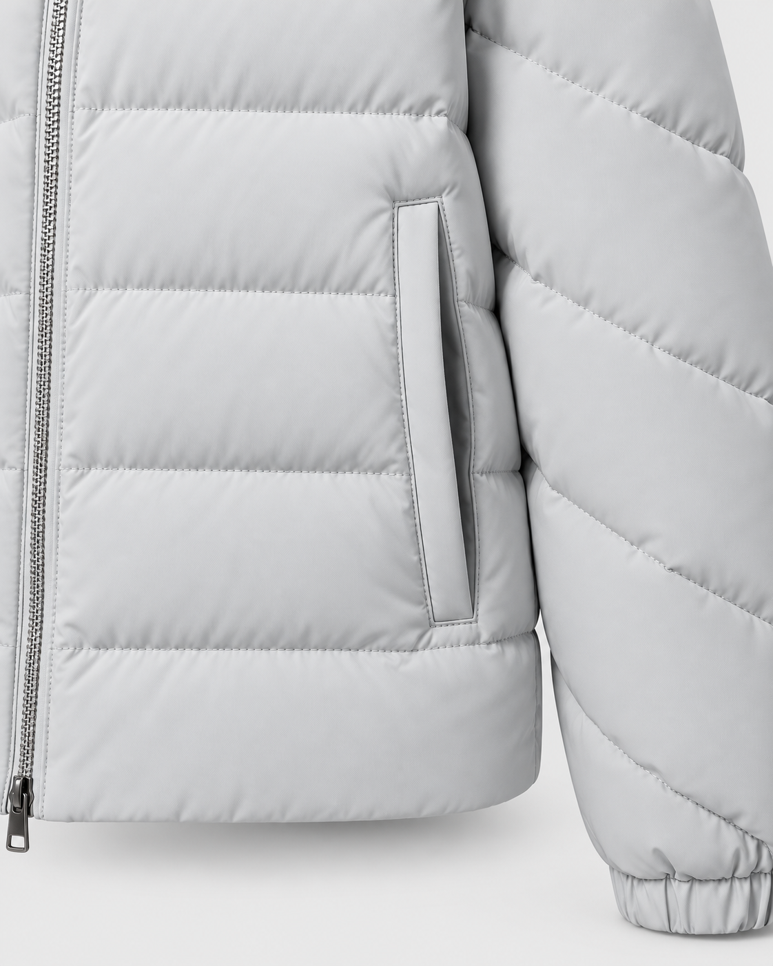 Gray | Close-up of the front zipper and side pocket on the quilted puffer jacket