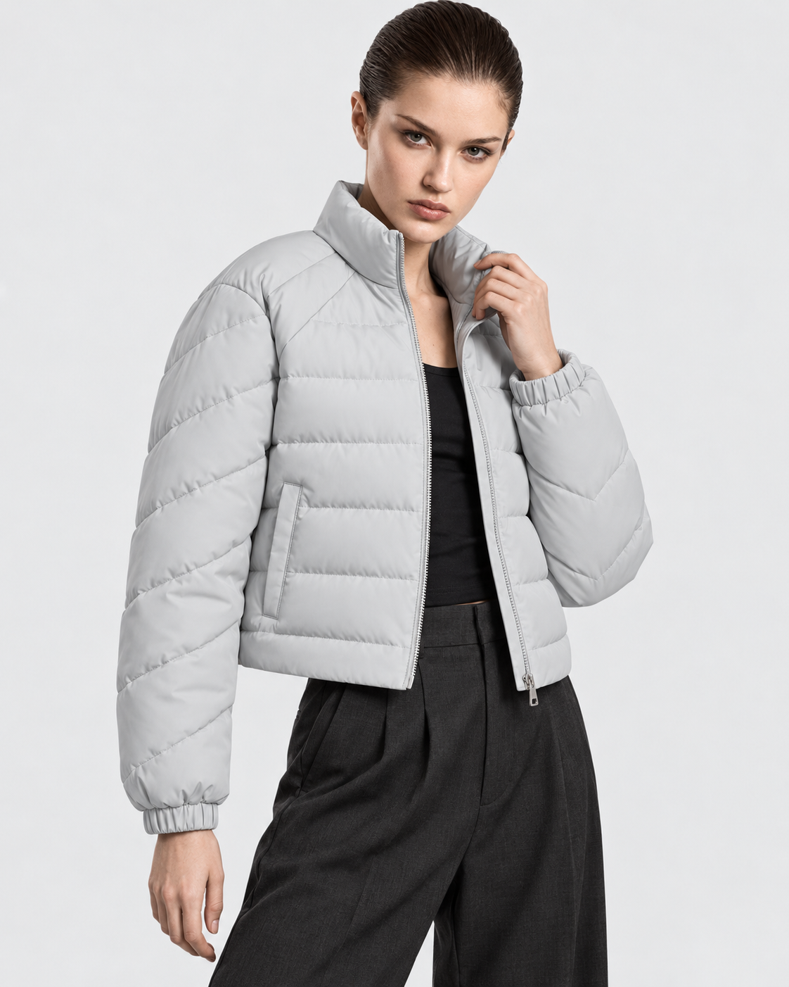 Image of Gray | Female model wearing the oversized quilted stand-collar puffer jacket in an alternate studio pose