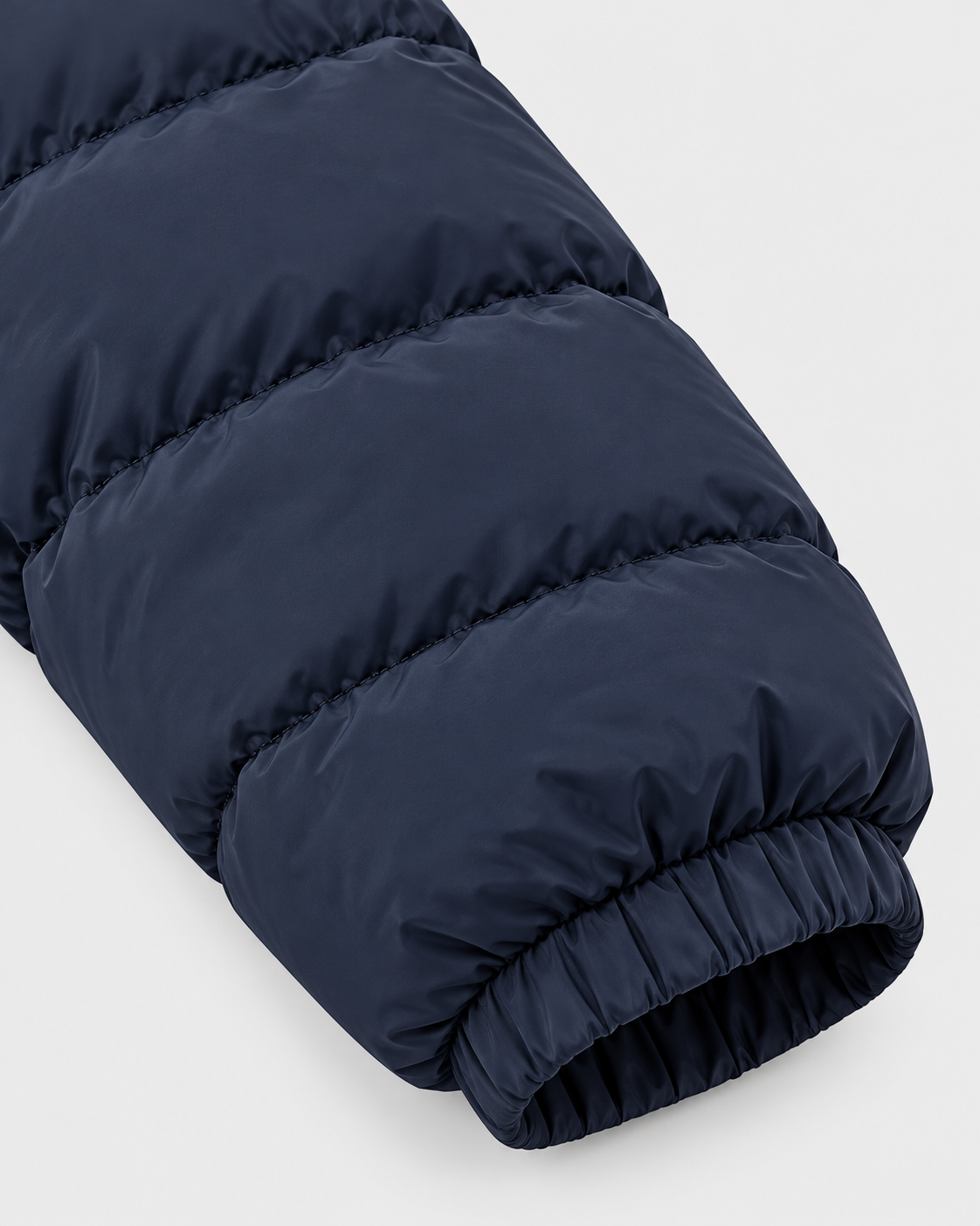 Navy Blue | Close-up of the quilted navy blue sleeve and elasticated cuff