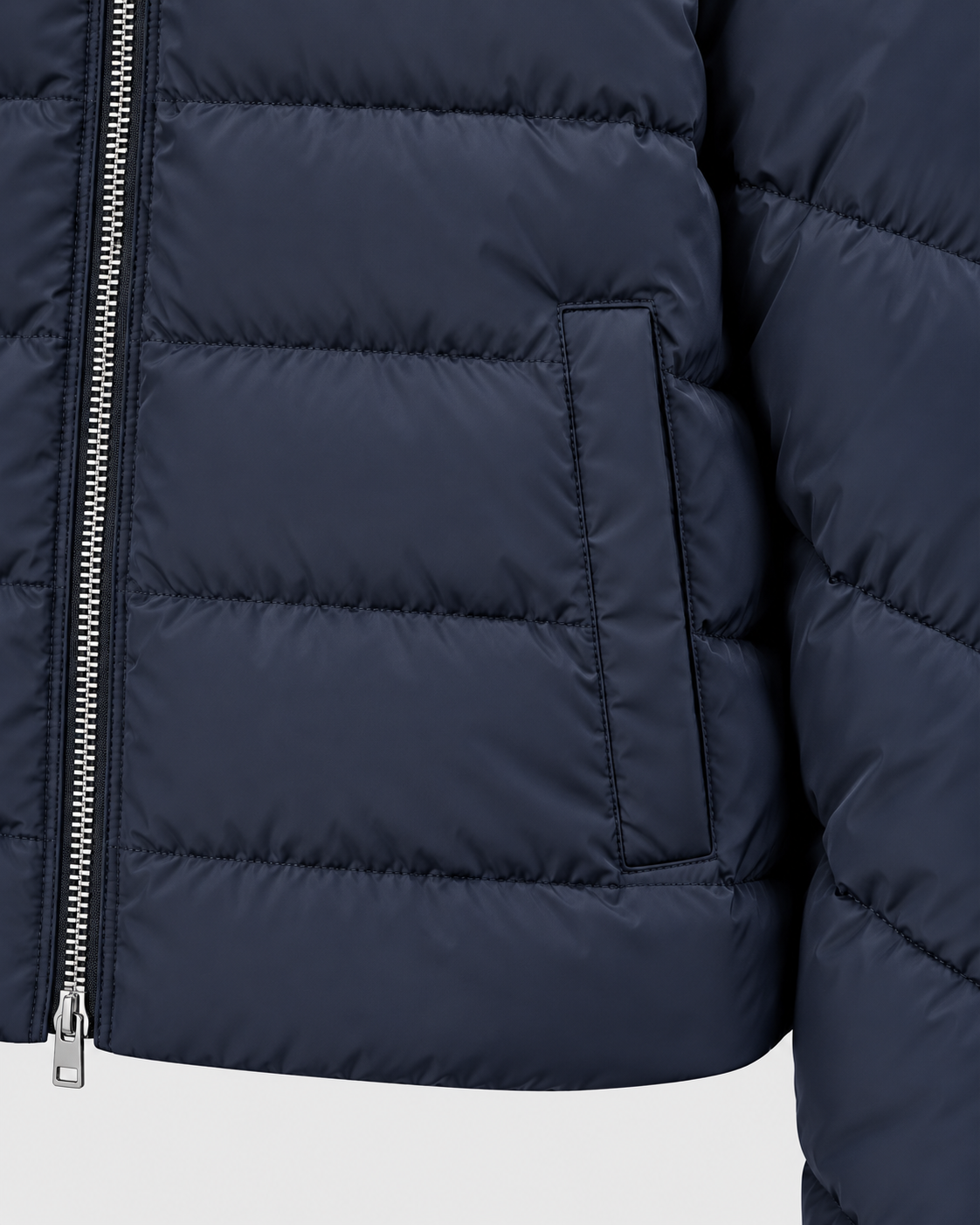 Navy Blue | Close-up of the navy blue puffer jacket front zipper and side pocket
