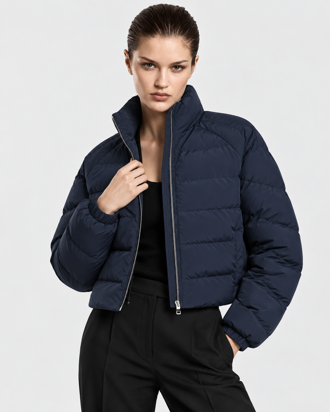 Image of Navy Blue | Female model wearing the navy blue stand-collar puffer jacket in an alternate studio pose