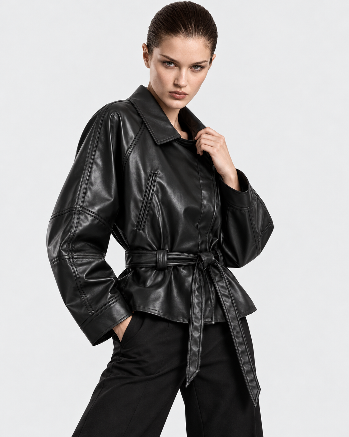 Image of Black | Model styling women's belted biker jacket in alternate pose