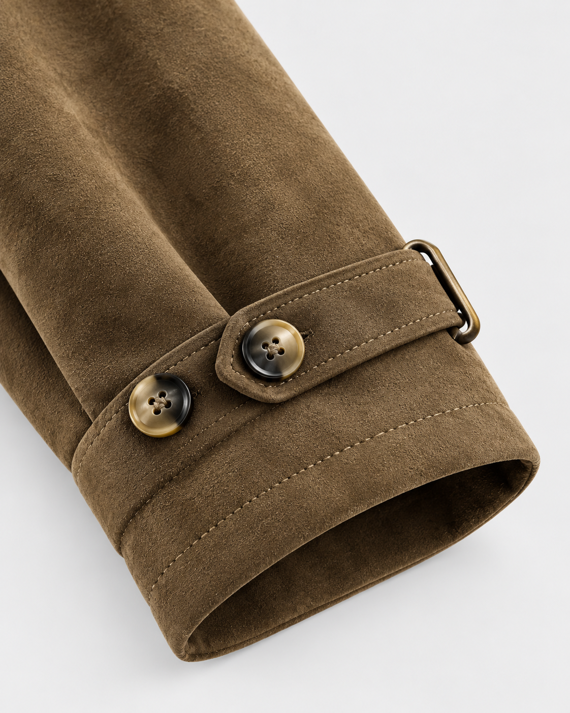 Camel | Close-up of cuff strap and buttons on camel trench coat