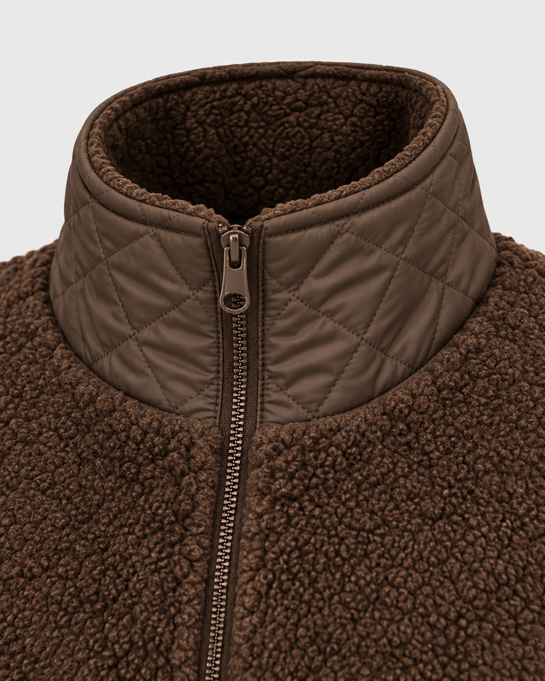 Brown | Close-up of high quilted collar and zipper on brown winter jacket
