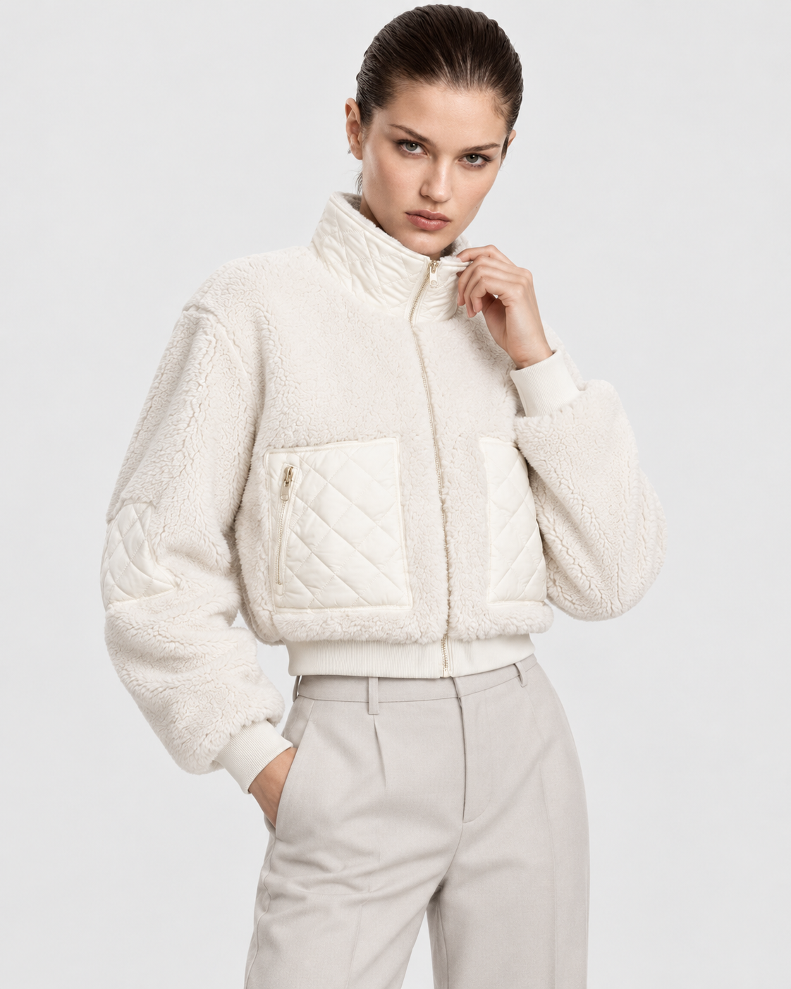 White | Model wearing women's white padded winter jacket, front pose