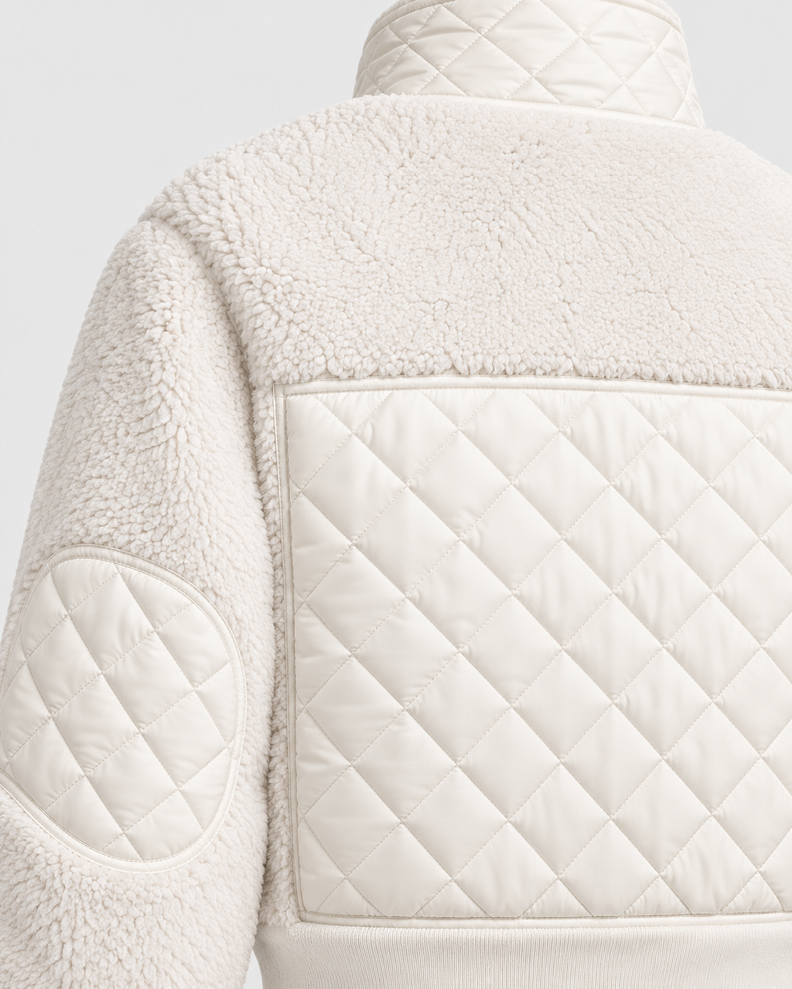 Image of White | Close-up of diamond quilting and fleece texture on padded jacket